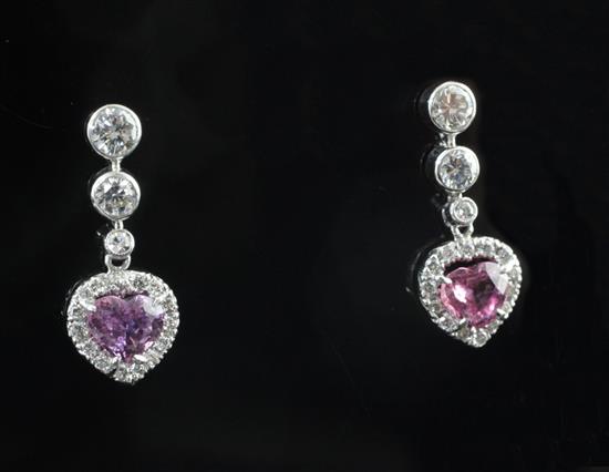 An attractive pair of 18ct white gold, heart shaped pink sapphire and diamond set drop earrings, 0.75in.